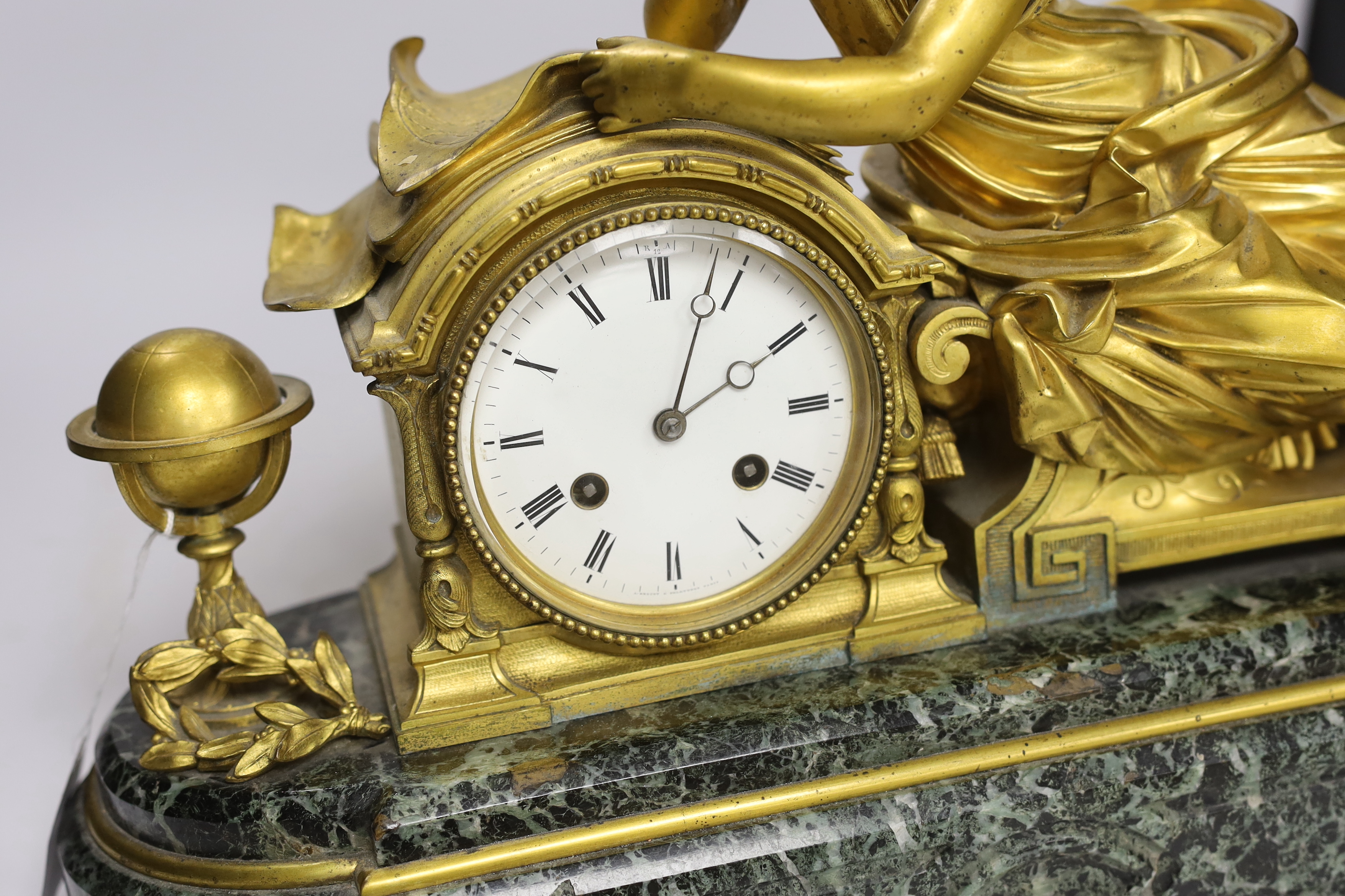 A late 19th century French ormolu and serpentine figural mantel clock, no key or pendulum, one foot missing, 47cm wide
